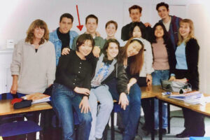 Nobue pictured with her classmates and teacher in 1999.