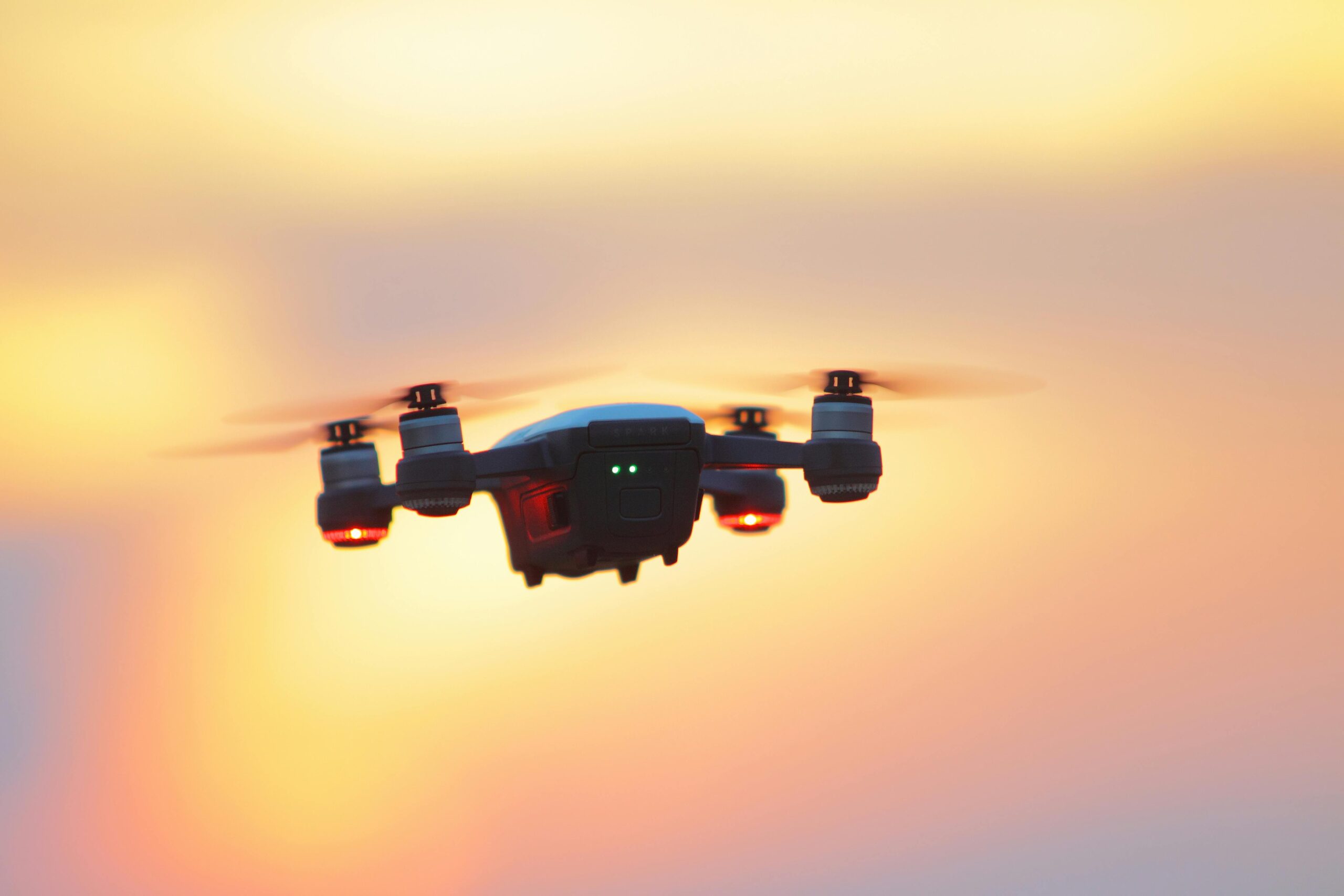 A drone flies in the sky with sunset colours in the background. This is an example of how students can get involved in drone flying in Bristol during their study stay. Photo by Pok Rie: https://www.pexels.com/photo/black-and-gray-dji-mavic-pro-drone-hovering-at-golden-hour-1353896/